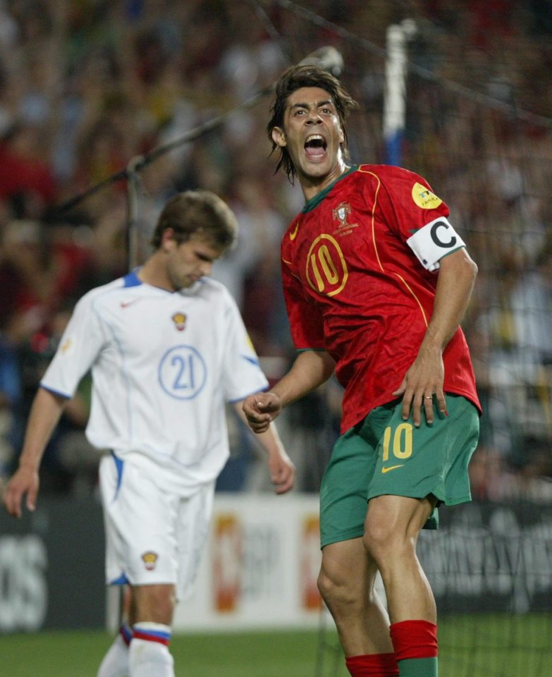 Bugayev looks down as Portugal striker Rui Costa celebrates after scoring in Euro 2004