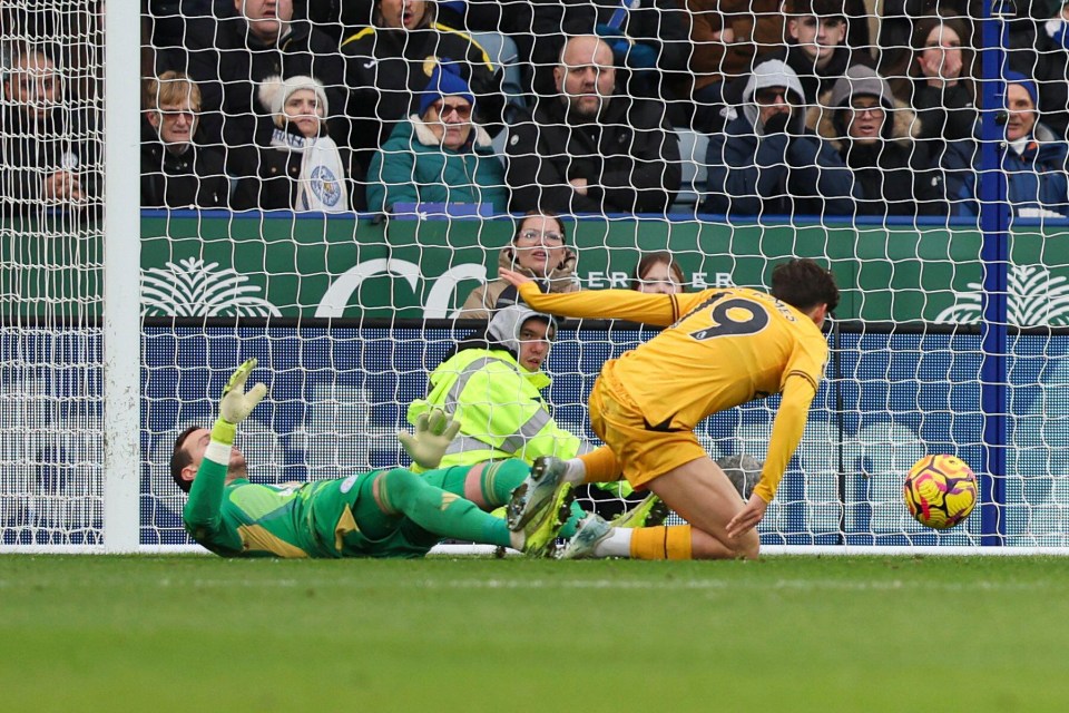 Rodrigo Gomes of Wolves scores a goal against Leicester City.