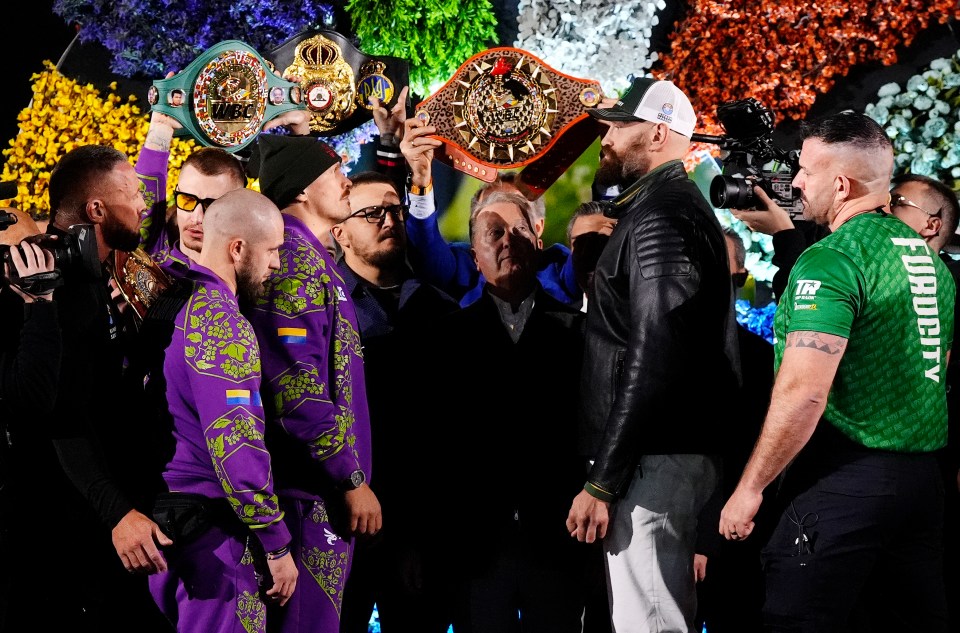 Usyk and Fury face off at a weigh-in.