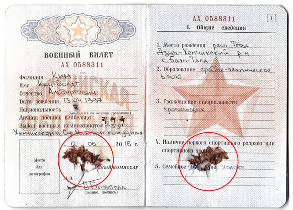 A fake ID provided to a different North Korean soldier by Russia that appears to have been shot through and bloodied