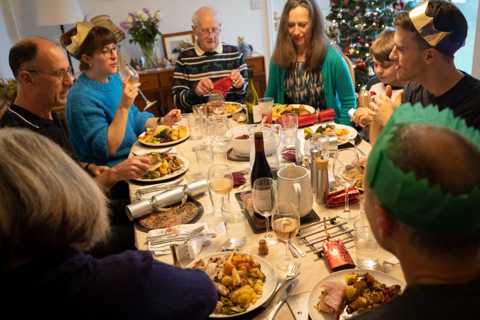 Family enjoying a large Christmas lunch together.