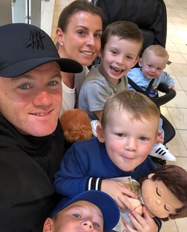 Coleen and Wayne Rooney pictured with their four sons