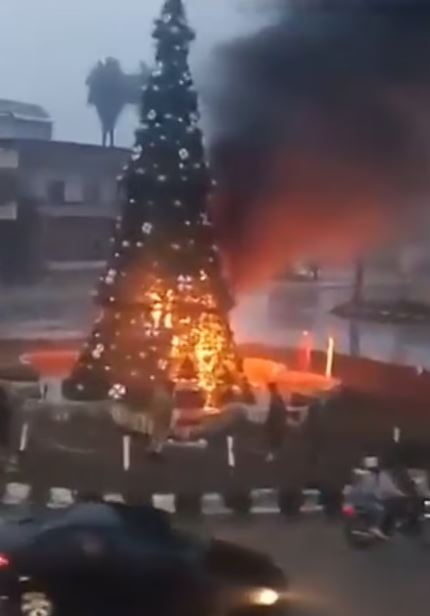 A Christmas tree was torched in the in the town square of Suqaylabiyah