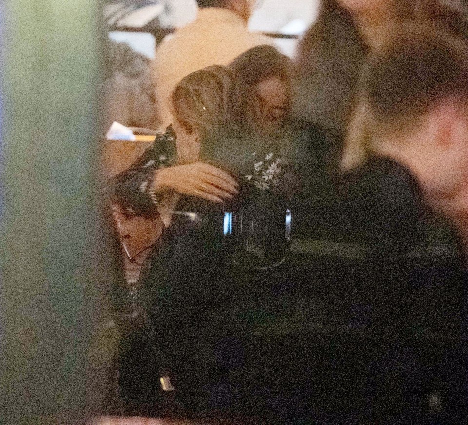 She was seen hugging her partner Michael at the London restaurant