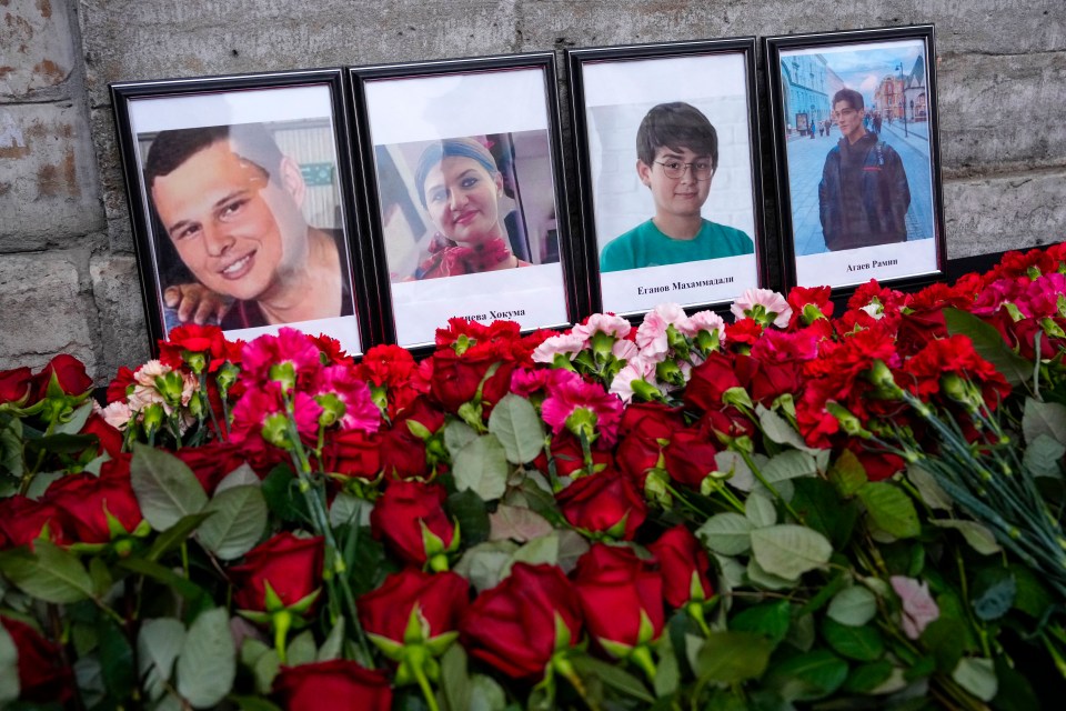 Memorial of flowers and photos of victims of an Azerbaijan Airlines plane crash.