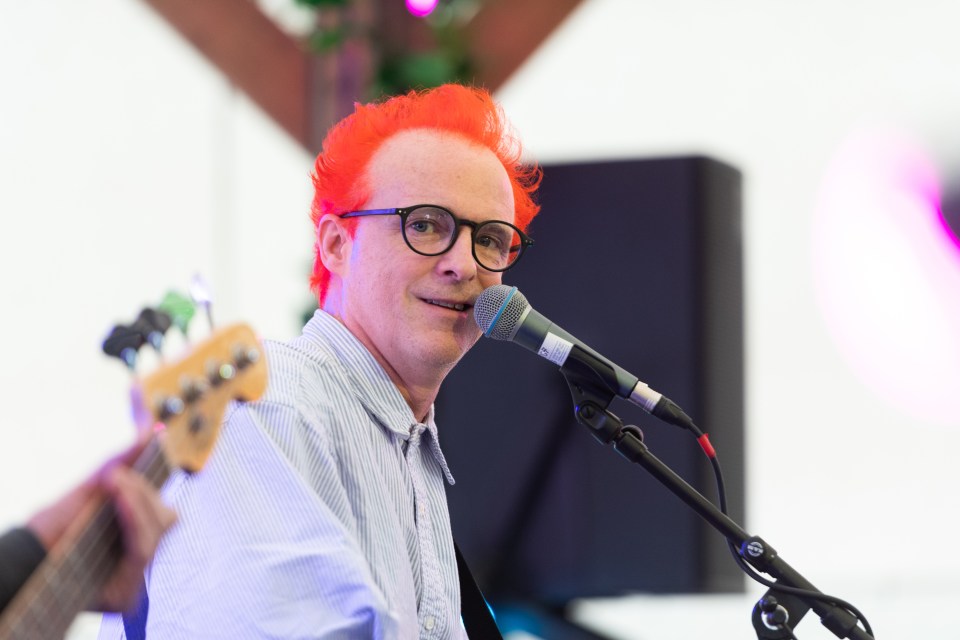 Fran Healy is now sporting a bright red dyed hairstyle and glasses