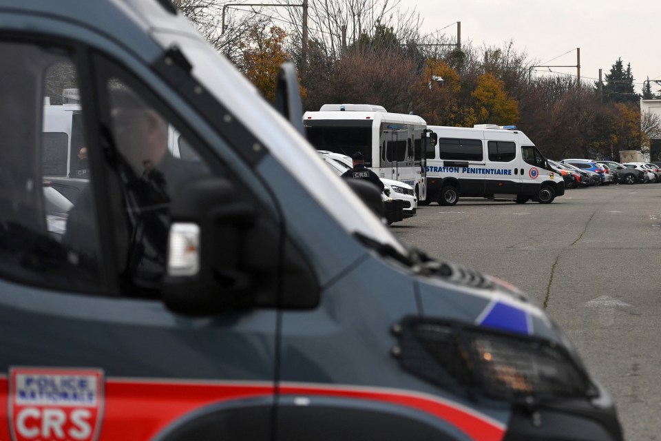 French police vans gather outside court to escort the men found guilty to prison