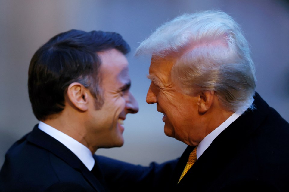 Macron and Trump embrace as they met at the Elysee Palace