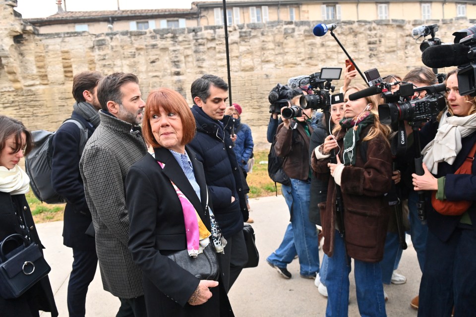 Gisèle smiles defiantly as she walks into court this morning