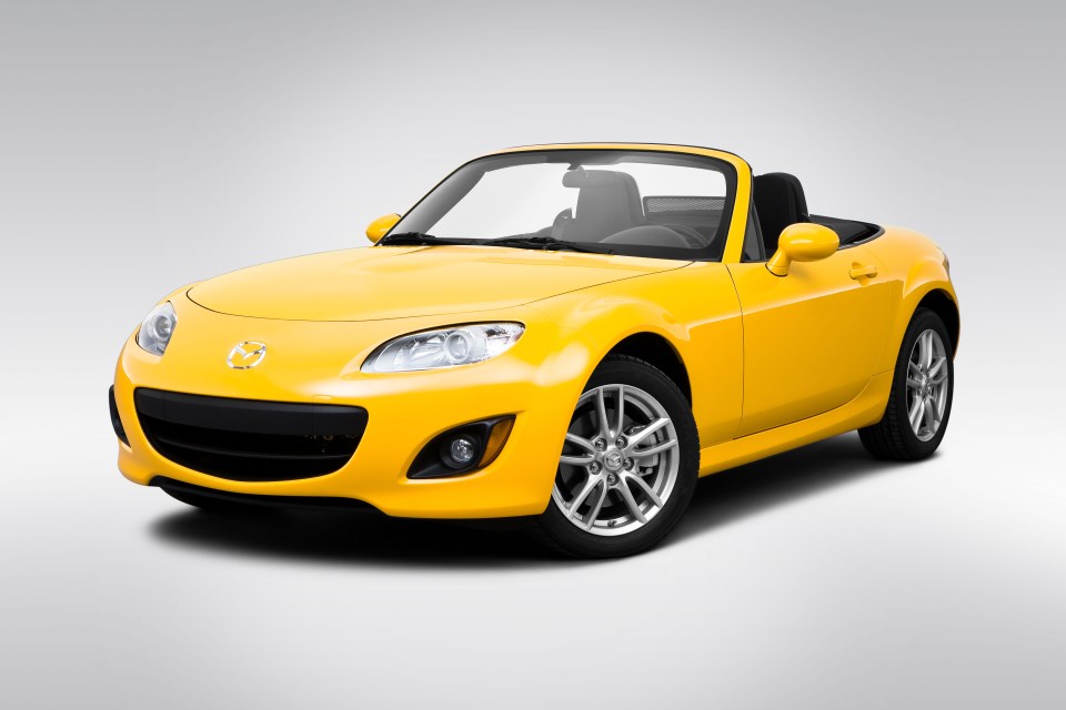 Yellow Mazda MX-5 convertible.