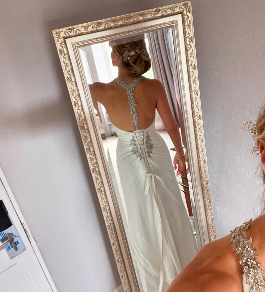 The dress was altered to fit, after being found through Facebook Marketplace