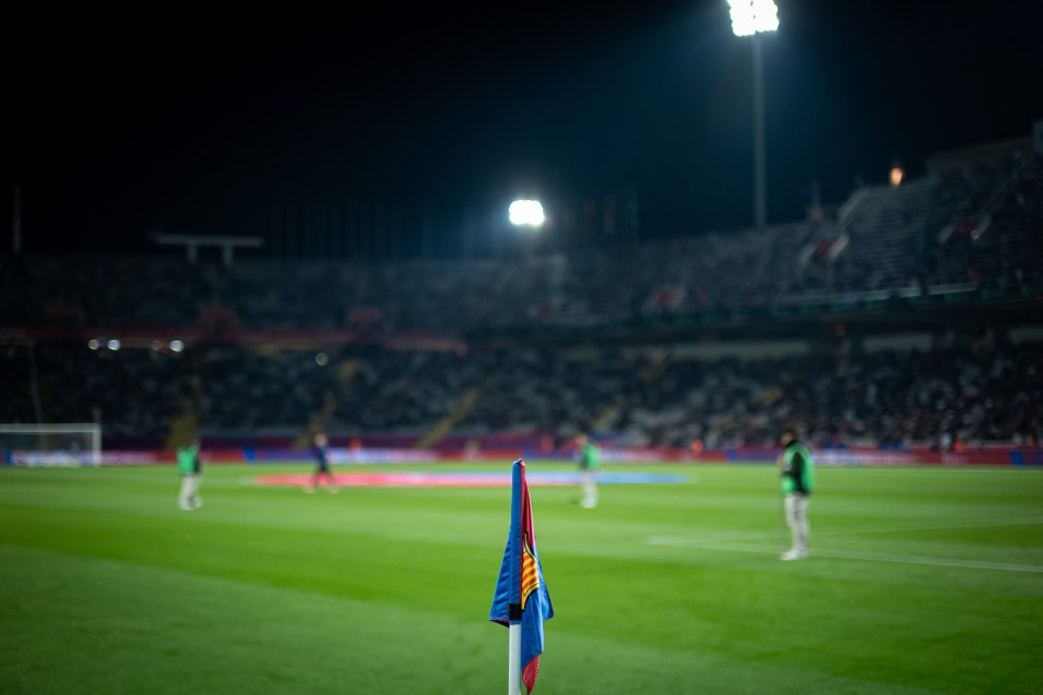 Corner flag at a night soccer game in a stadium.