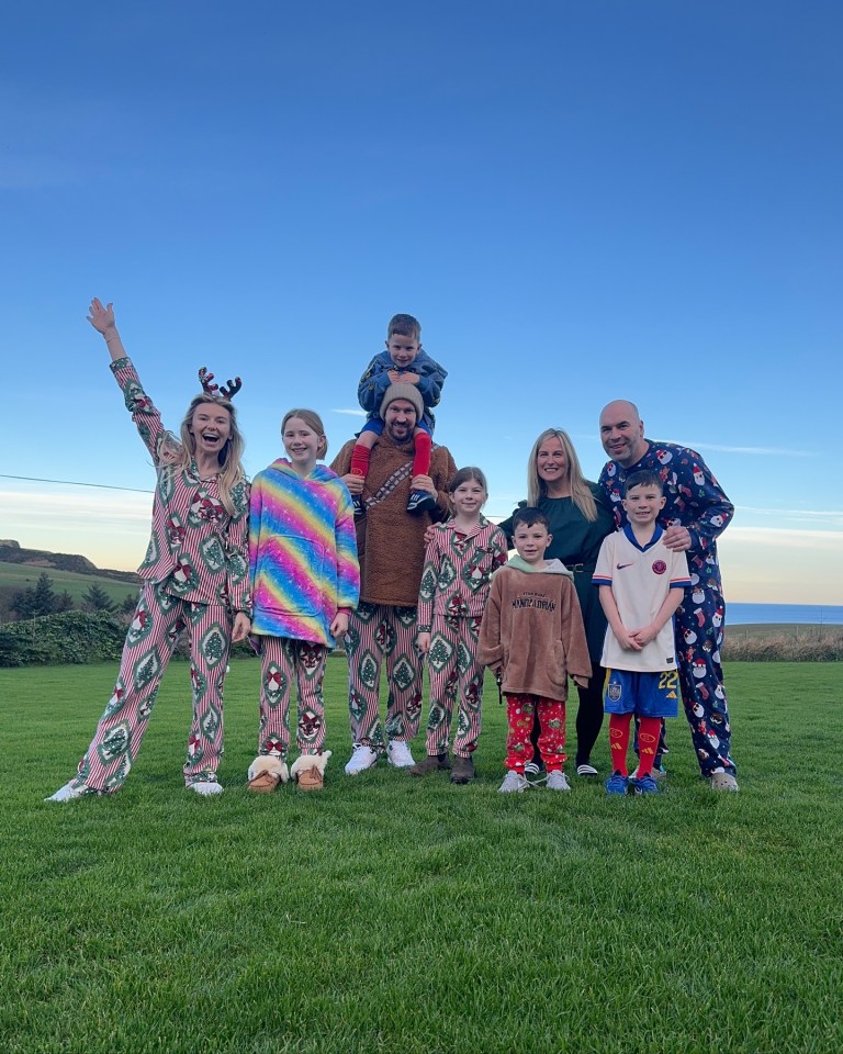 The couple pose with family members in Scotland