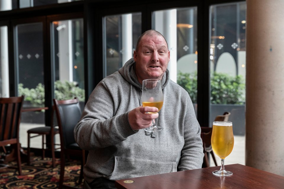 Graham Newton, 59, enjoys a quiet pint before going back home in the Stick & Twist, Leeds city centre, on Christmas day