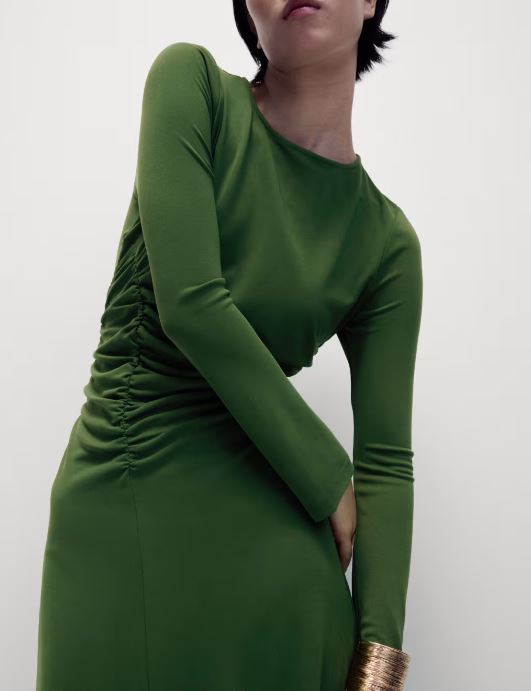 Green midaxi dress with long sleeves and ruching at the side.