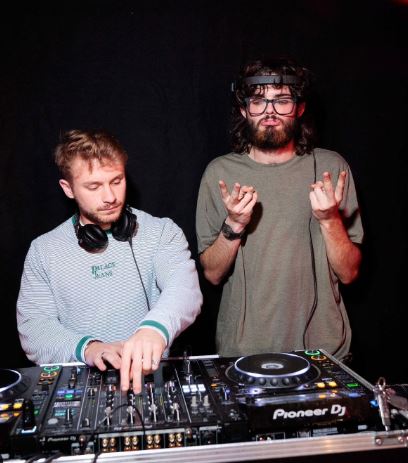 DJ Geronimo James poses behind the decks after a Halloween gig this year