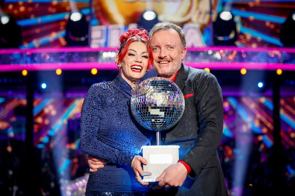 Dianne Buswell and Chris McCausland lifted the glitterball trophy