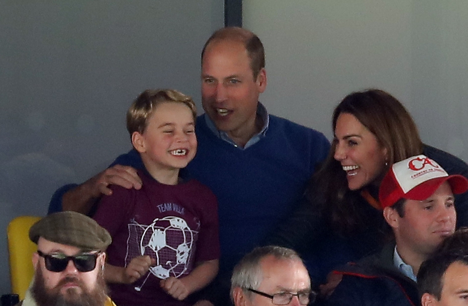 Prince Louis' big brother George celebrates a goal while watching Aston Villa with his dad Wills and mum Kate