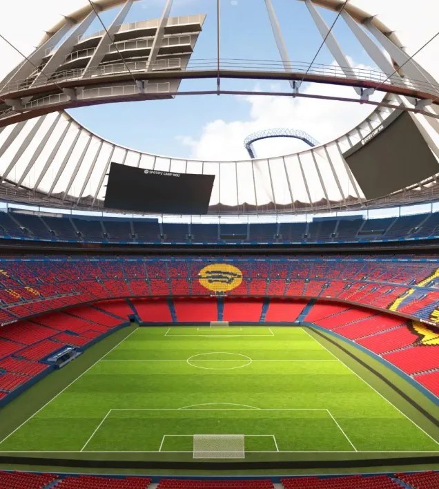 Empty soccer stadium with red seats.