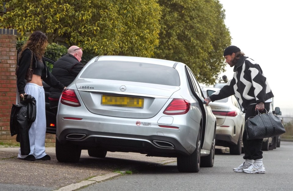 Pete helped load Maura's items into a Mercedes