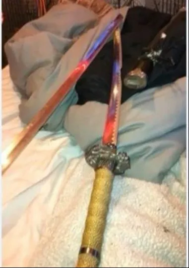 Katana sword on a bed.