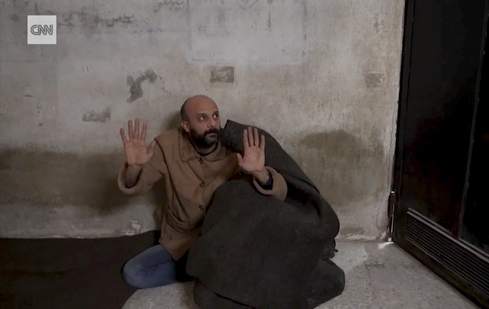 The TV crew found the apparent Syrian prisoner hiding under a blanket