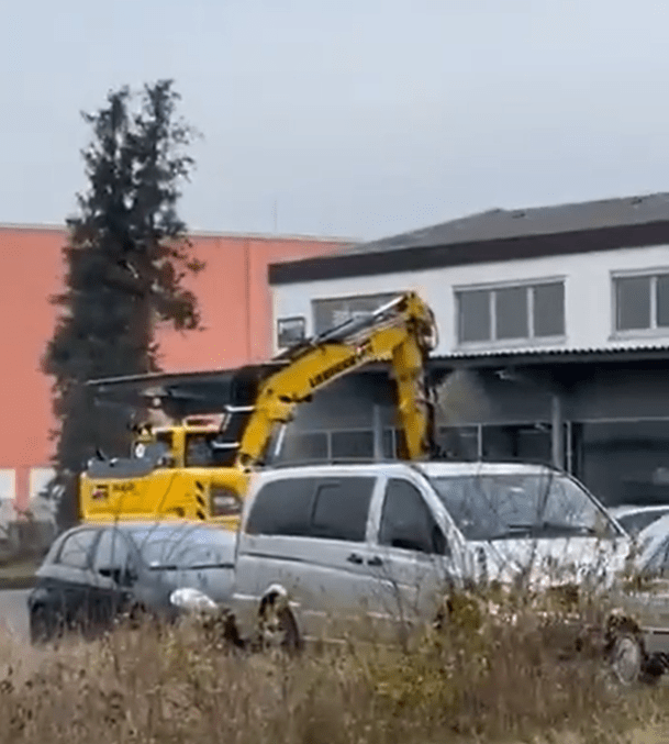 The stolen digger rammed into a car dealership in Germany before the driver was shot dead