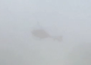 Helicopter in fog.