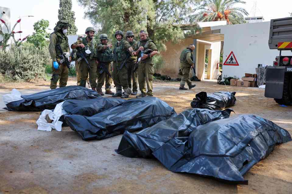 Entire families were gunned down by Hamas in Kfar Aza (pictured) - a village close to the Gaza border