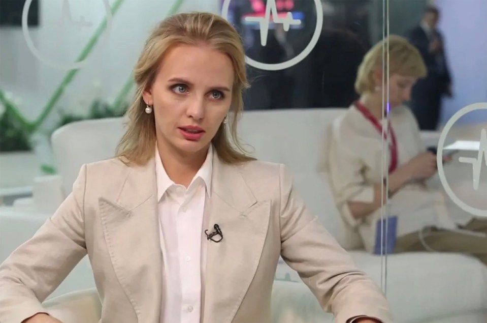 Woman in beige blazer during interview.