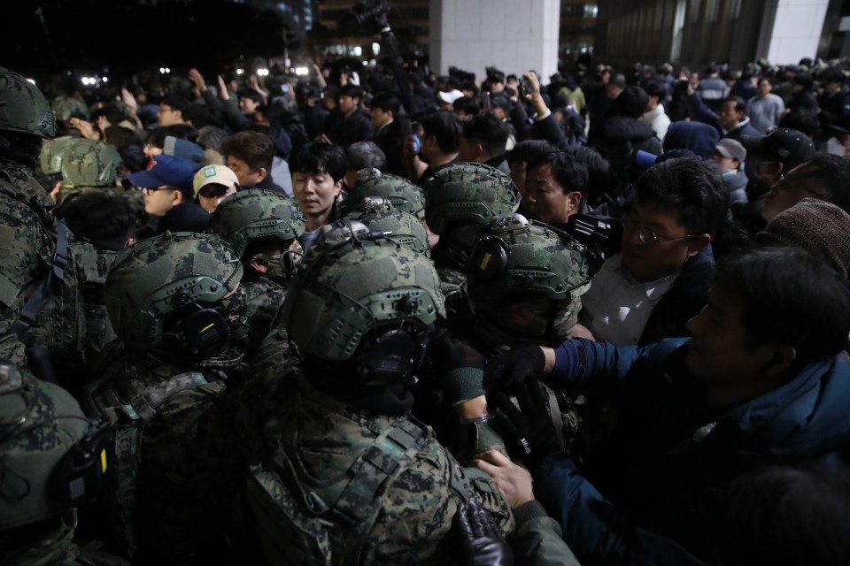 Troops clash with protesters on 3 December after martial law was declared in South Korea