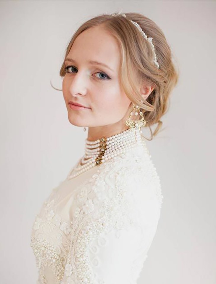 Woman in a pearl-embellished wedding dress.