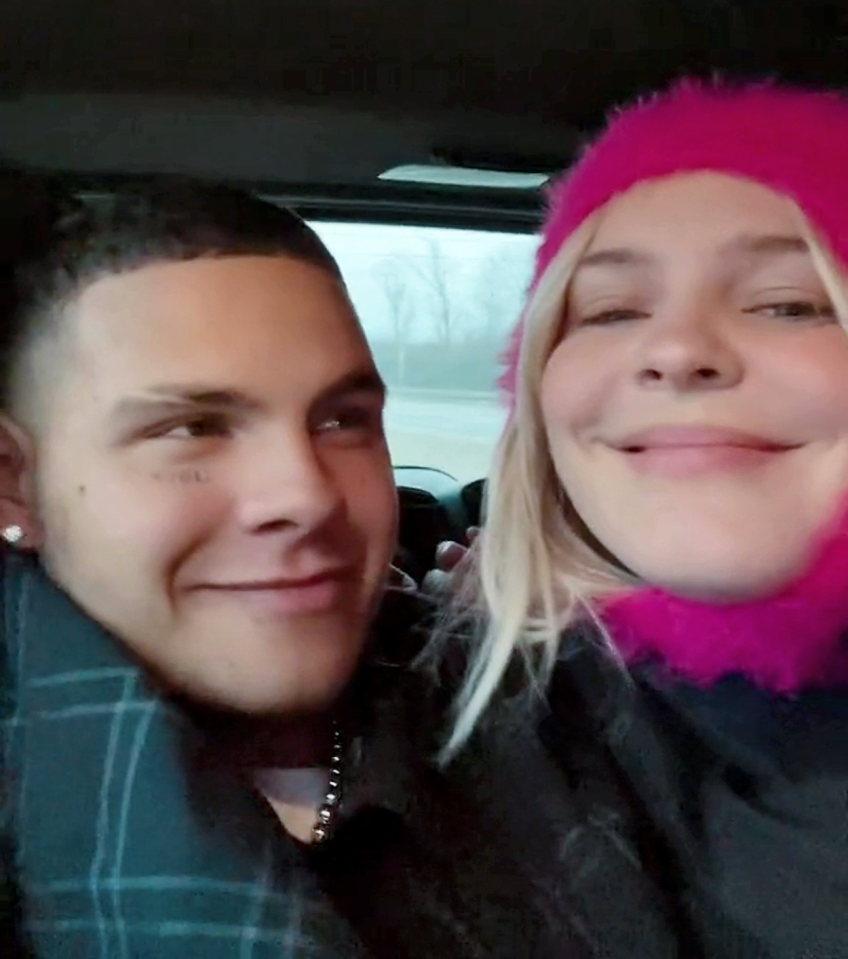 Close-up of a young couple in a car.