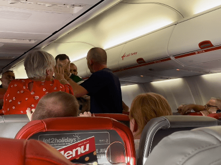 Other passengers tried to calm down one of the men involved in the brawl