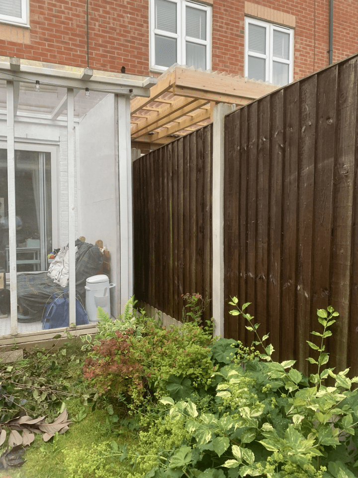 A woman has revealed that her 'horrible' neighbours have not only taken a part of her front garden, but they've also built a pergola overhanging their fence too