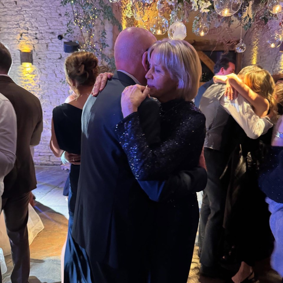 Jasper Carrott slow dancing with his wife at their son's wedding.