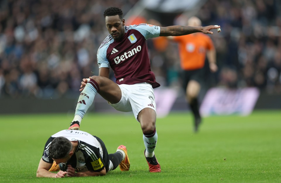 Jhon Duran of Aston Villa fouls a Newcastle United player, resulting in a red card.