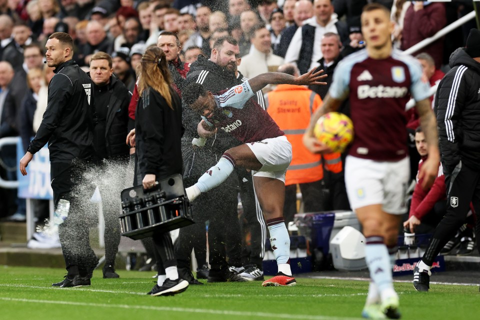 Jhon Duran of Aston Villa kicks a water bottle after receiving a red card.