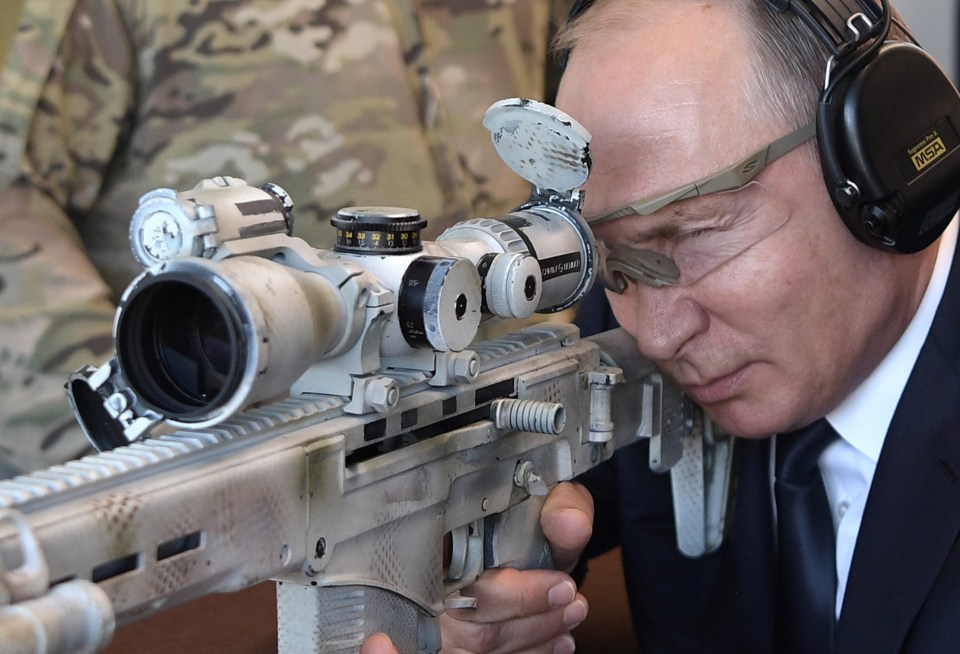 Putin looking down the sights of a sniper rifle