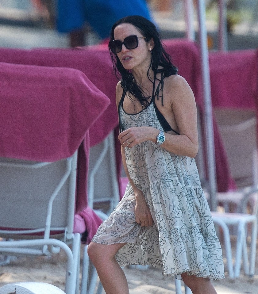 A 90s popstar has looked stunning on the beach in Barbados