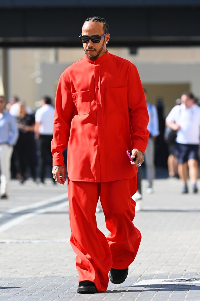 Lewis Hamilton wore a striking red outfit, or Ferrari colours, in the Abu Dhabi paddock