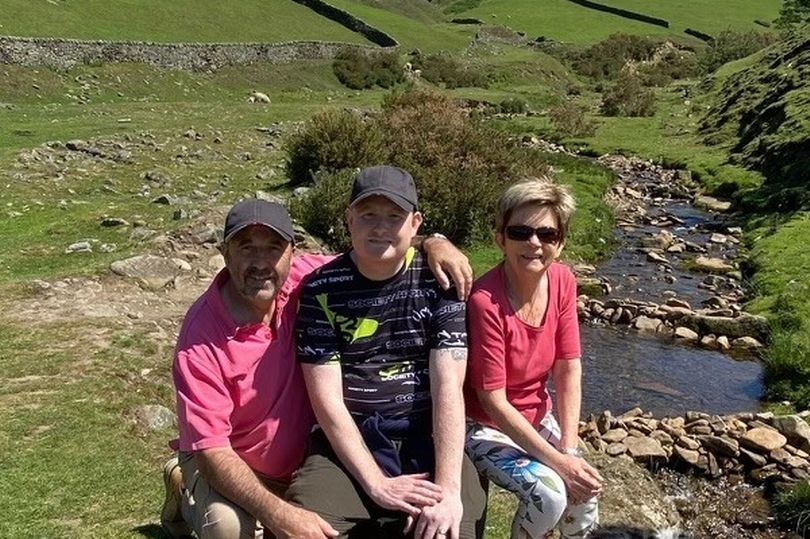 Liam started to develop chest pain, which doctors put down to anxiety (Pictured with his parents)