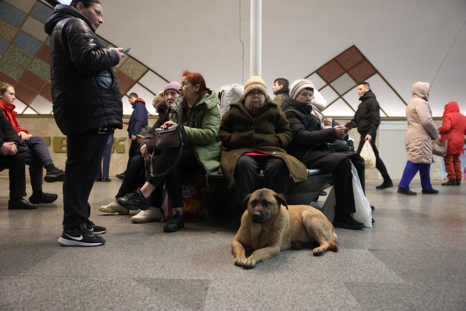 Local residents take shelter in a metro station during an air strike alarm in Kyiv