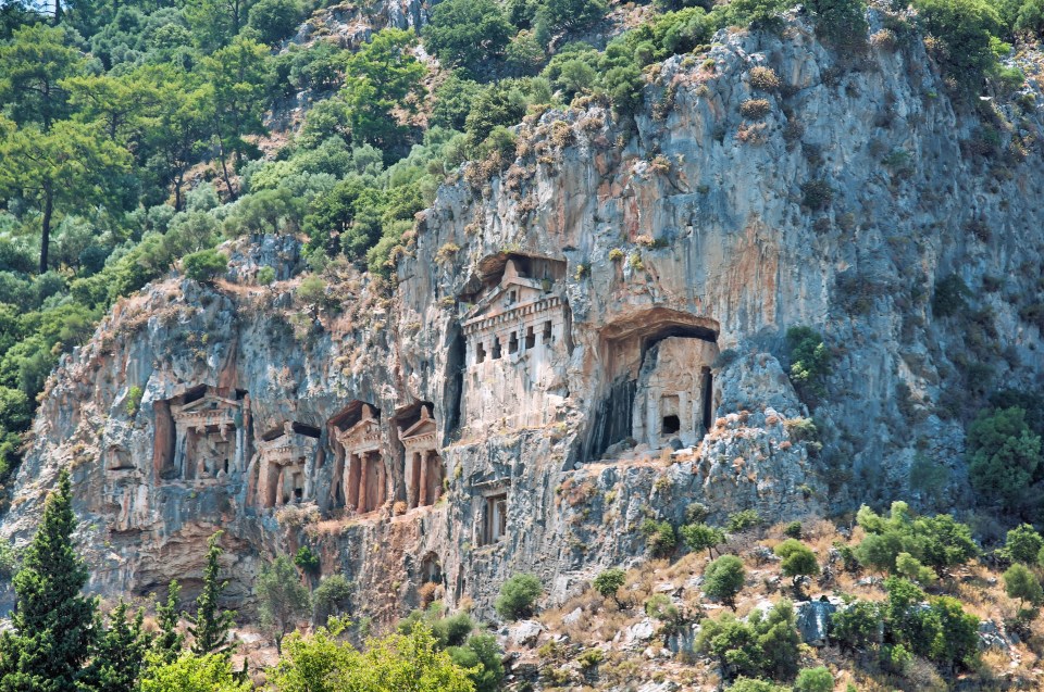 Lycian rock tombs carved into a cliff face.