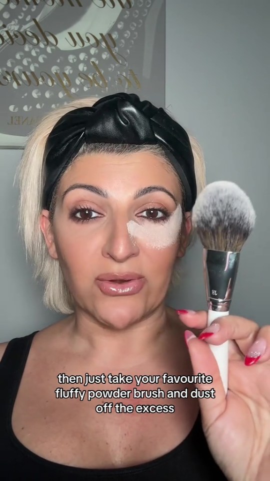 She then uses her favourite powder brush to dust off the excess