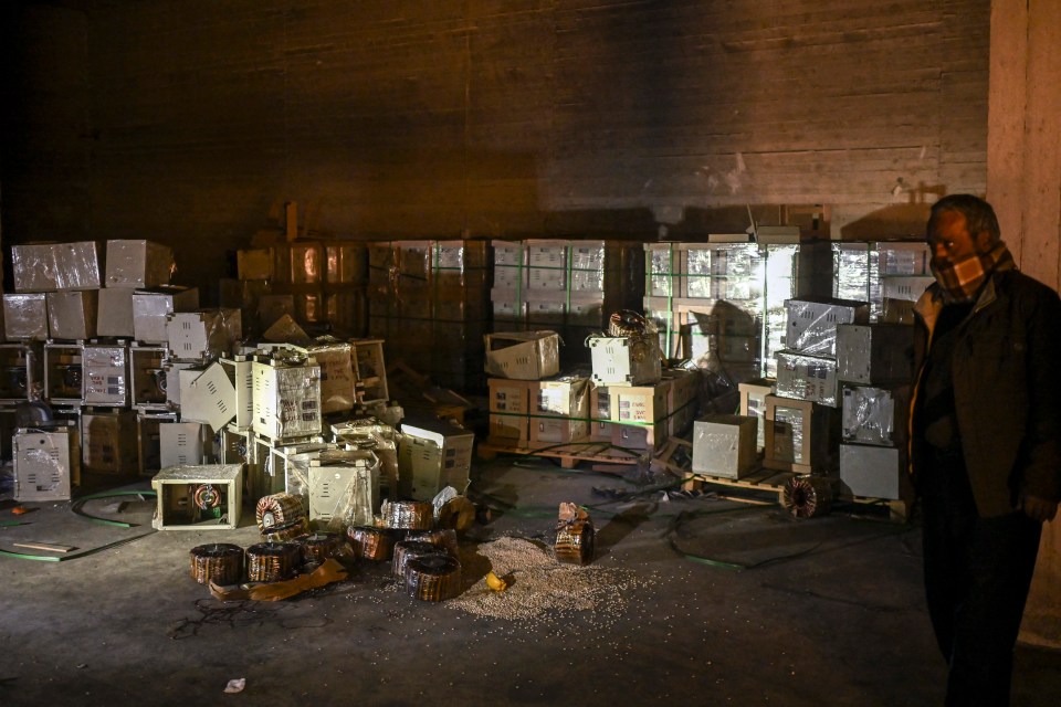 A man stands by electrical storage components that were used to hide Captagon