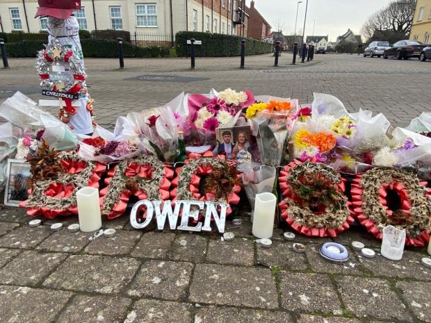 Flowers lined the streets at the scene of the crime