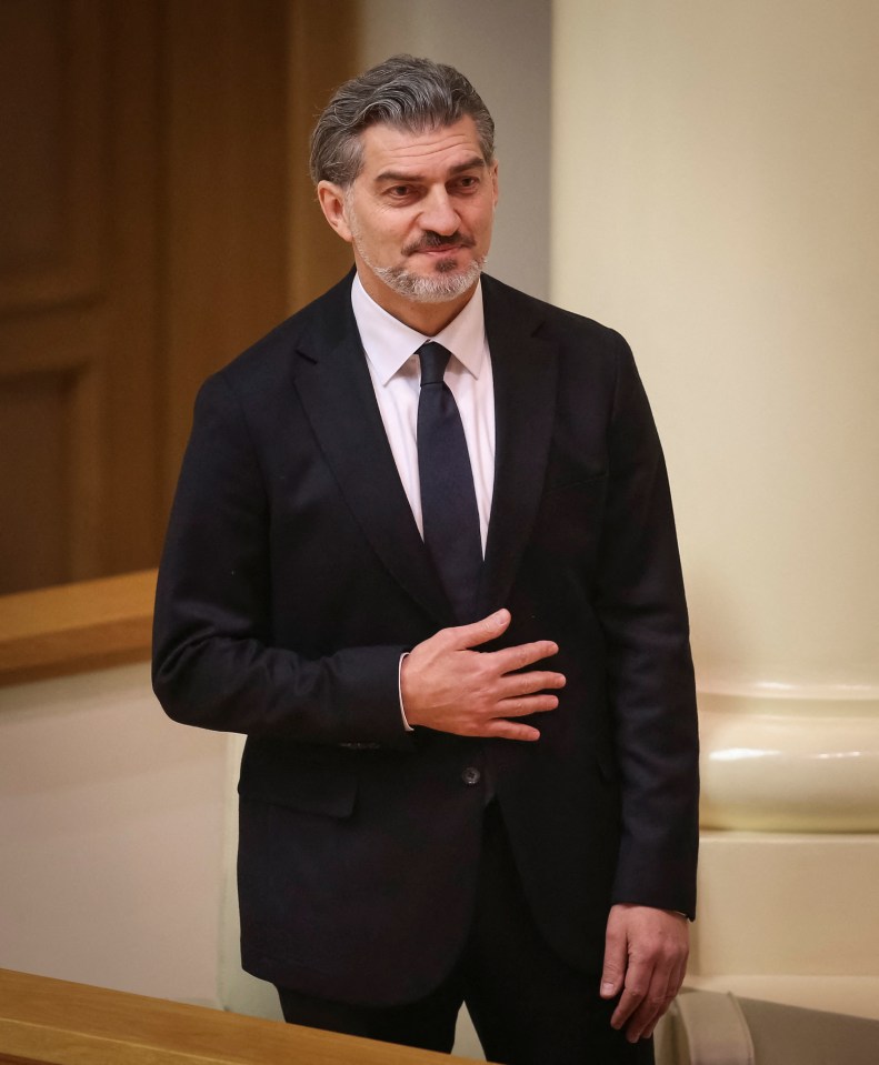 Mikheil Kavelashvili reacts after he was elected the country's new president in the parliament, in Tbilisi, Georgia