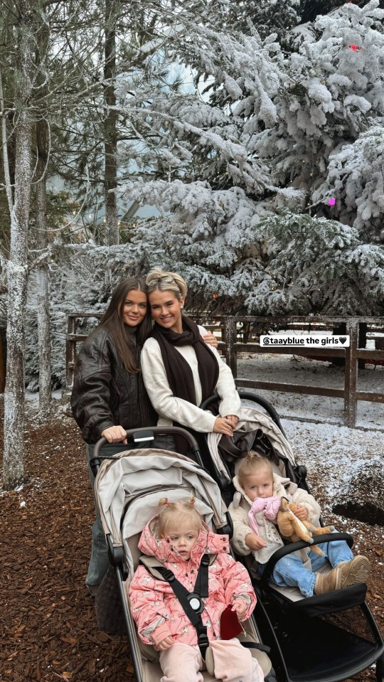 Molly-Mae Hague and a friend with their daughters in a double stroller at Lapland UK.