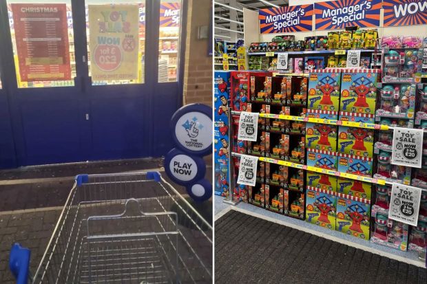 Empty shopping cart and store toy sale.